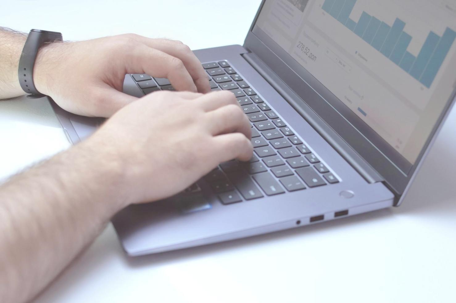 Professional software testing environment with multiple screens showing test results